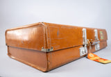 Vintage 1960s Revelation Tan Leather Suitcase With Travel Labels. - Harrington Antiques