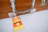 Vintage 1960s Revelation Tan Leather Suitcase With Travel Labels. - Harrington Antiques