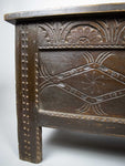 Antique 17th Century Carved Oak Coffer With Raised Legs & Original Iron Loop Hinges. - Harrington Antiques