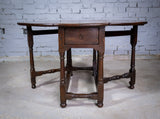 Early 18th Century English Oak Gate Leg Table With Central Drawer. - Harrington Antiques