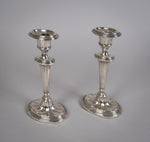 Pair Of Sterling Silver Neoclassical Candlesticks by Charles Boyton & Sons, 1911. - Harrington Antiques