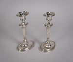 Pair Of Sterling Silver Neoclassical Candlesticks by Charles Boyton & Sons, 1911. - Harrington Antiques