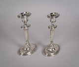 Pair Of Sterling Silver Neoclassical Candlesticks by Charles Boyton & Sons, 1911. - Harrington Antiques