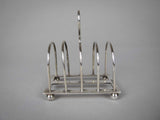 Sterling Silver Five Bar Toast Rack by William Hutton & Sons, Sheffield, 1907. - Harrington Antiques