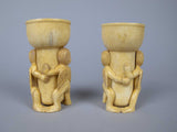 Unusual Pair of 19th Century Carved Bone Cherub Candle Holders. - Harrington Antiques